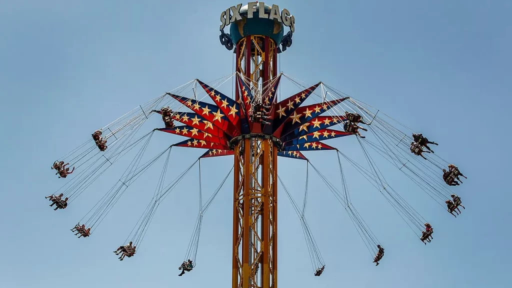 Six Flags Over Georgia riders suspended in air on swing ride