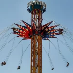 Six Flags Over Georgia riders suspended in air on swing ride